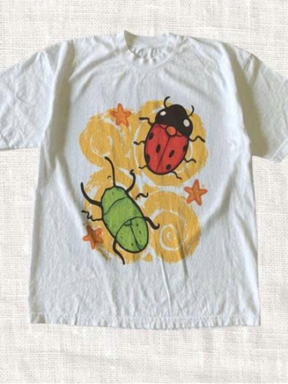 White Short Sleeve Tee with Red and Green Beetle Graphic